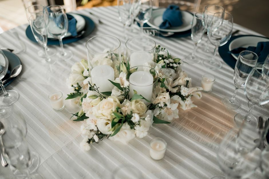 Planning team arranging a reception table before guests arrive